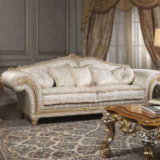 Classic three seater sofa, golden and carved details and cymatium, fabric finish. Carved table, golden and silver leaf finish