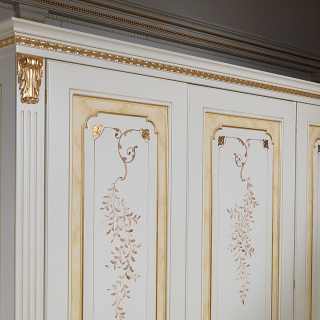 Modular classic wardrobe withe and gold finish. Flower decorations, carved and golden pillars, golden details