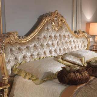 Bed with capitonné headboard and luxury handmade carvings, gold and silver leaf