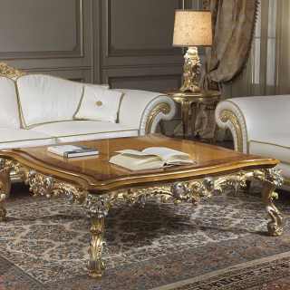 Classic living room Imperial with carved sofa and armchair, carved and golden details, white leather finish. Carved table, gold and silver finish