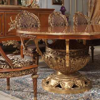Classic luxury furniture Versailles collection, Luigi XVI style: myrtle briar table with rich golden carvings, carved and upholstered chairs. All walnut and gold leaf finish