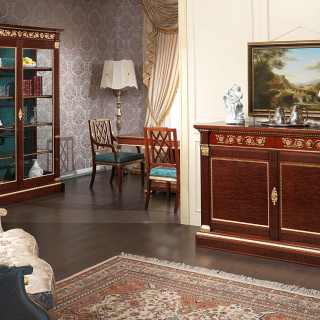 Ermitage living room, impero style. Mahogany glass showcase and sideboard with brass decorations and gold leaf details. Mahogany and gold leaf table