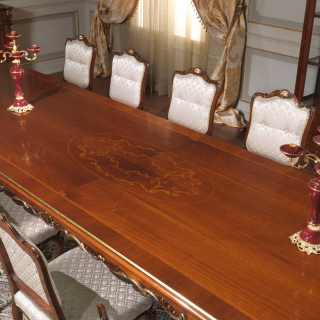 Carved and inlayed ractangular table, walnut decapé finish; upholstered and carved chairs, Luigi XV style, Parigi collection