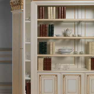 Classic bookcase, ivory lacquered finish with carvings and gold decorations. Hidden shelves on the columns